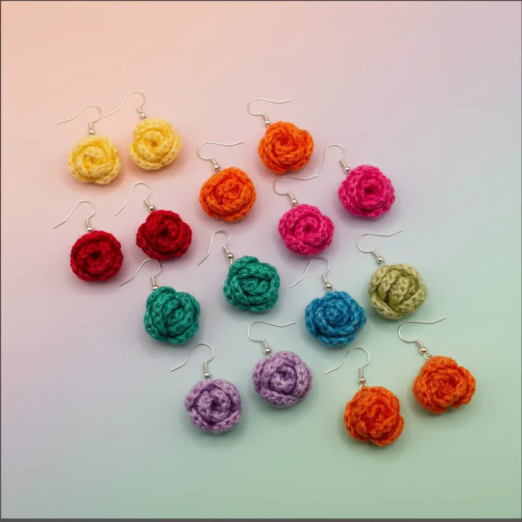 A set of colorful handmade crochet flower dangle earrings with silver fishhook wires, arranged on a pastel gradient background.